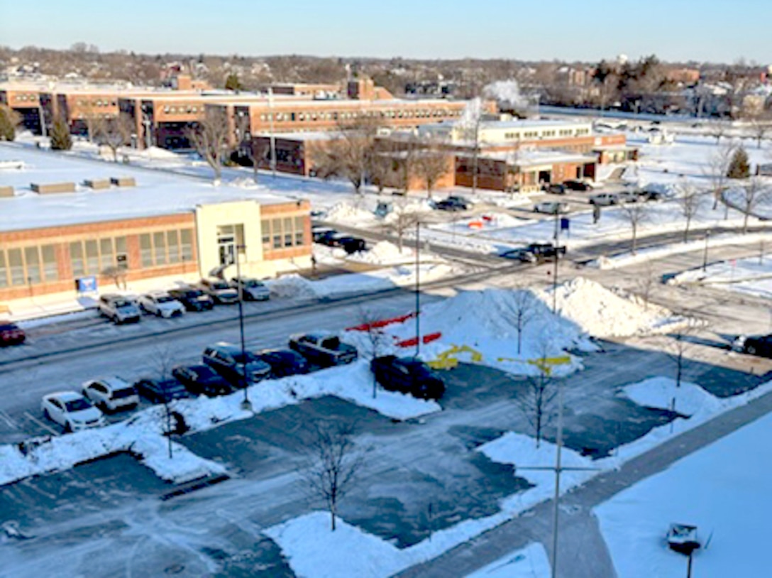 Buildings, roads and parking lots appear snowy and icy after an intense winter storm.
