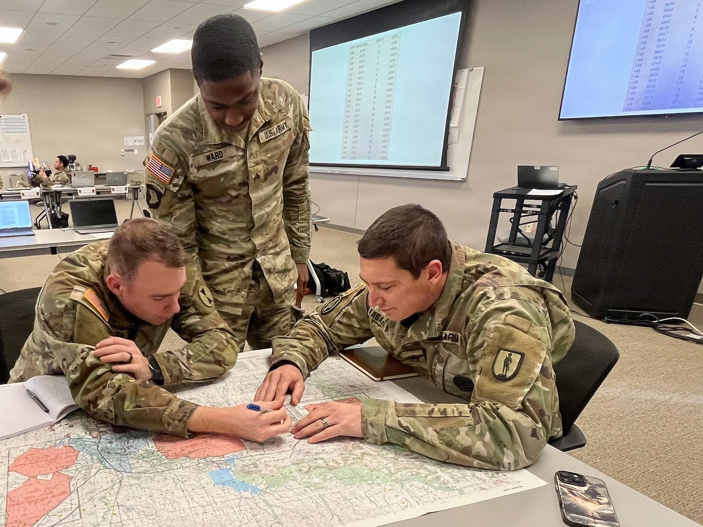 Students assigned to the 13R Advanced Leader Course collaborate during a tactical planning exercise at the 213th Regional Training Institute in Guernsey, Wyoming, Jan. 22, 2026.