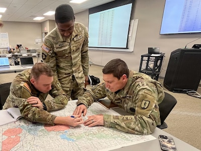 Students assigned to the 13R Advanced Leader Course collaborate during a tactical planning exercise at the 213th Regional Training Institute in Guernsey, Wyoming, Jan. 22, 2026.