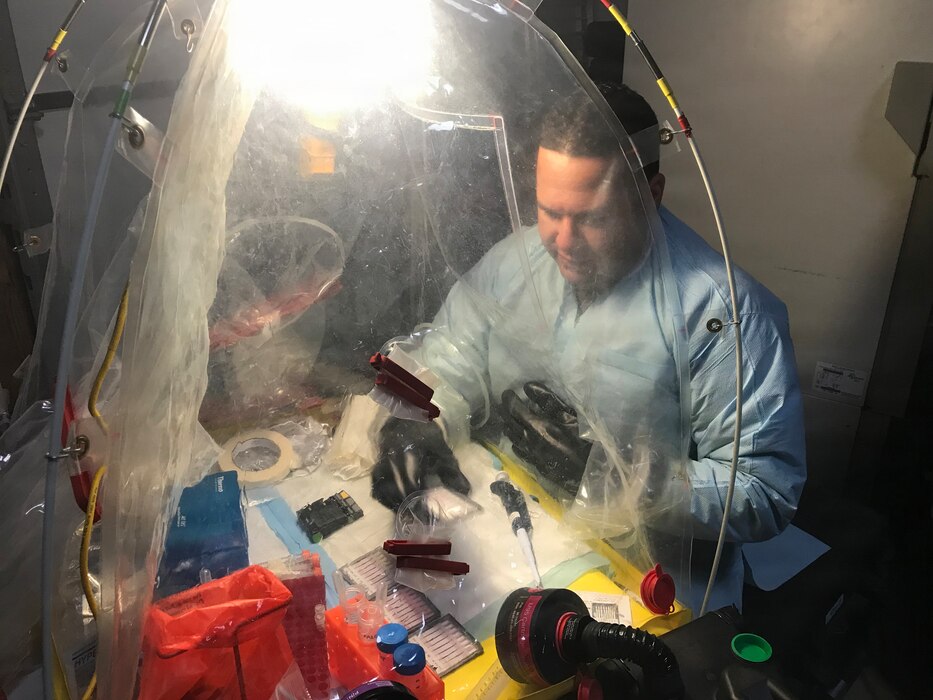 Lt. Cmdr. Elih M. Velazquez-Delgado, a biochemist assigned as the officer in charge for the Navy’s premier fly-away biowarfare agent detection laboratory in support of Chairman of the Joint Chiefs of Staff Priority-One Classified Mission, implementing cutting edge biosurveillance and detection capabilities within Navy operational forces, the National Guard Civil Support Teams, U.S. Marine Chemical and Biological Incident Response Forces and State Public Health Laboratories Incident Response at the Naval Medical Research Laboratory’s Biological Defense Research Directorate in Frederick Md., Mar. 7, 2018. (U.S. Navy photo)