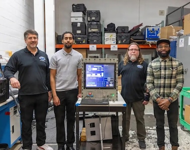 Engineers assigned to Mid-Atlantic Regional Maintenance Center's (MARMC) Submarine Towed Systems Branch (Code 274) pose for a photo with a modernized computer system.