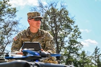 U.S. Army Specialist Elija Kirkland, 1st Battalion, 119th Field Artillery Regiment battery cannon crew member conducts drone operations during Exercise Northern Strike.