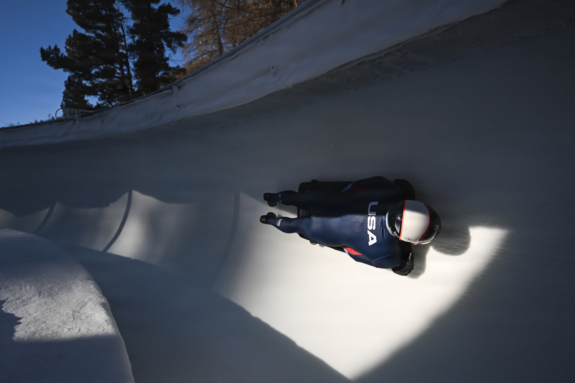 A USA Olympic teammember sleds down the tube.