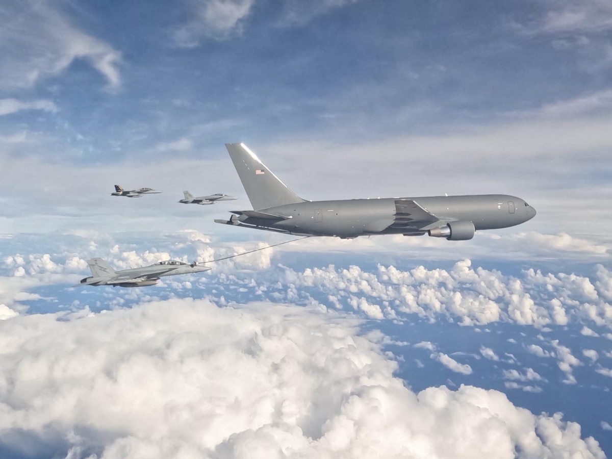 KC-46A Pegasus flying with clouds in background
