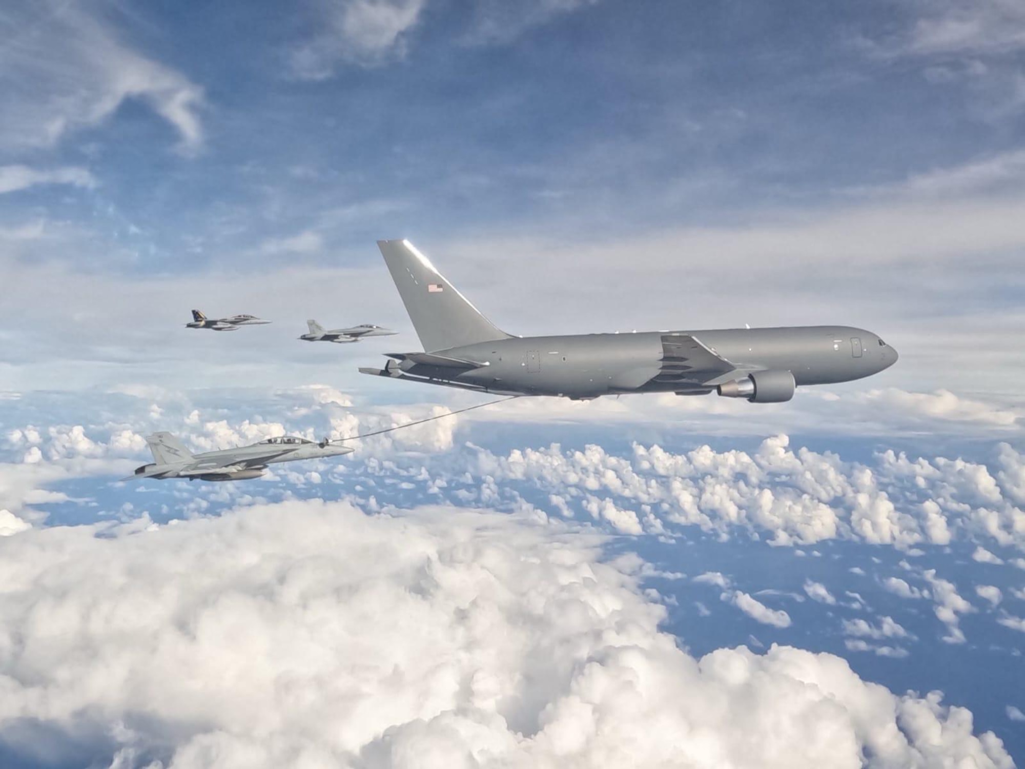 KC-46A Pegasus flying with clouds in background