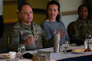 People sit in a room.