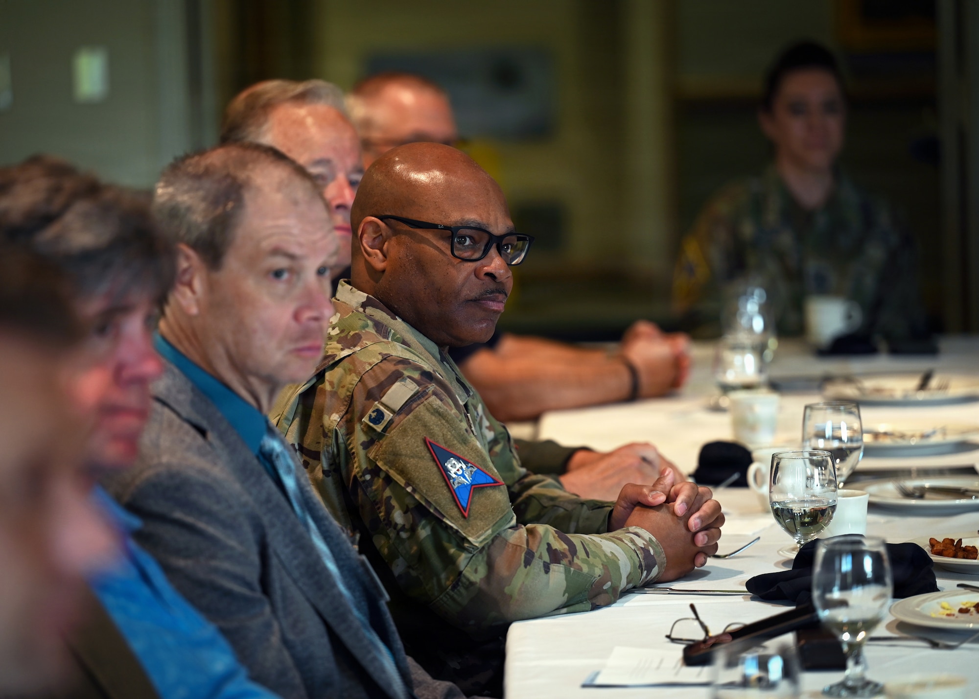 People sit in a room.