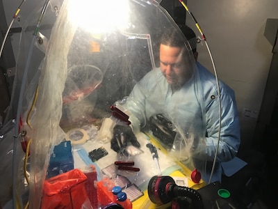 Lt. Cmdr. Elih M. Velazquez-Delgado, a biochemist assigned as the officer in charge for the Navy’s premier fly-away biowarfare agent detection laboratory in support of Chairman of the Joint Chiefs of Staff Priority-One Classified Mission, implementing cutting edge biosurveillance and detection capabilities within Navy operational forces, the National Guard Civil Support Teams, U.S. Marine Chemical and Biological Incident Response Forces and State Public Health Laboratories Incident Response at the Naval Medical Research Laboratory’s Biological Defense Research Directorate in Frederick Md., Mar. 7, 2018. (U.S. Navy photo)