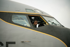 U.S. Air Force Capt. Alex West, a KC-135 Stratotanker pilot and current Chief of Scheduling in the 186th Air Refueling Wing Operation Group, prepares to fly at Key Field Air National Guard Base, Miss., Jan. 28, 2025. West experiences firsthand the dual role of pilots as both aviators and military officers.