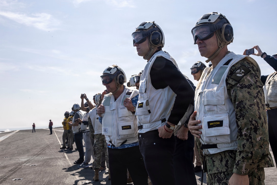 U.S. Special Envoy for Peace Missions Steve Witkoff, left, Jared Kushner, center, and U.S. Navy Adm. Brad Cooper, commander of U.S. Central Command, right, observe flight operations aboard Nimitz-class aircraft carrier USS Abraham Lincoln (CVN 72) in the Arabian Sea, Feb. 7, 2026. Abraham Lincoln is deployed to the U.S. 5th Fleet area of operations to support maritime security and stability in the Middle East. (U.S. Navy photo by Mass Communication Specialist 2nd Class Sonny Escalante)