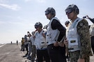 U.S. Special Envoy for Peace Missions Steve Witkoff, left, Jared Kushner, center, and U.S. Navy Adm. Brad Cooper, commander of U.S. Central Command, right, observe flight operations aboard Nimitz-class aircraft carrier USS Abraham Lincoln (CVN 72) in the Arabian Sea, Feb. 7, 2026. Abraham Lincoln is deployed to the U.S. 5th Fleet area of operations to support maritime security and stability in the Middle East. (U.S. Navy photo by Mass Communication Specialist 2nd Class Sonny Escalante)