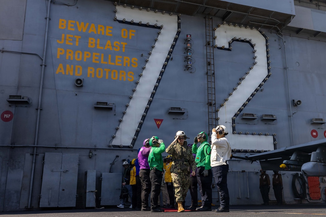 U.S Navy Adm. Brad Cooper, commander of U.S. Central Command, departs Nimitz-class aircraft carrier USS Abraham Lincoln (CVN 72) in the Arabian Sea, Feb. 7, 2026. Abraham Lincoln is deployed to the U.S. 5th Fleet area of operations to support maritime security and stability in the U.S. Central Command area of responsibility. (U.S. Navy photo by Mass Communication Specialist Seaman Angel Campbell)