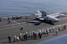 Distinguished visitors observe flight operations on the flight deck of Nimitz-class aircraft carrier USS Abraham Lincoln (CVN 72) in the Arabian Sea, Feb. 7, 2026. Abraham Lincoln is deployed to the U.S. 5th Fleet area of operations to support maritime security and stability in the Middle East. (U.S. Navy photo by Mass Communication Specialist Seaman Hannah Tross)