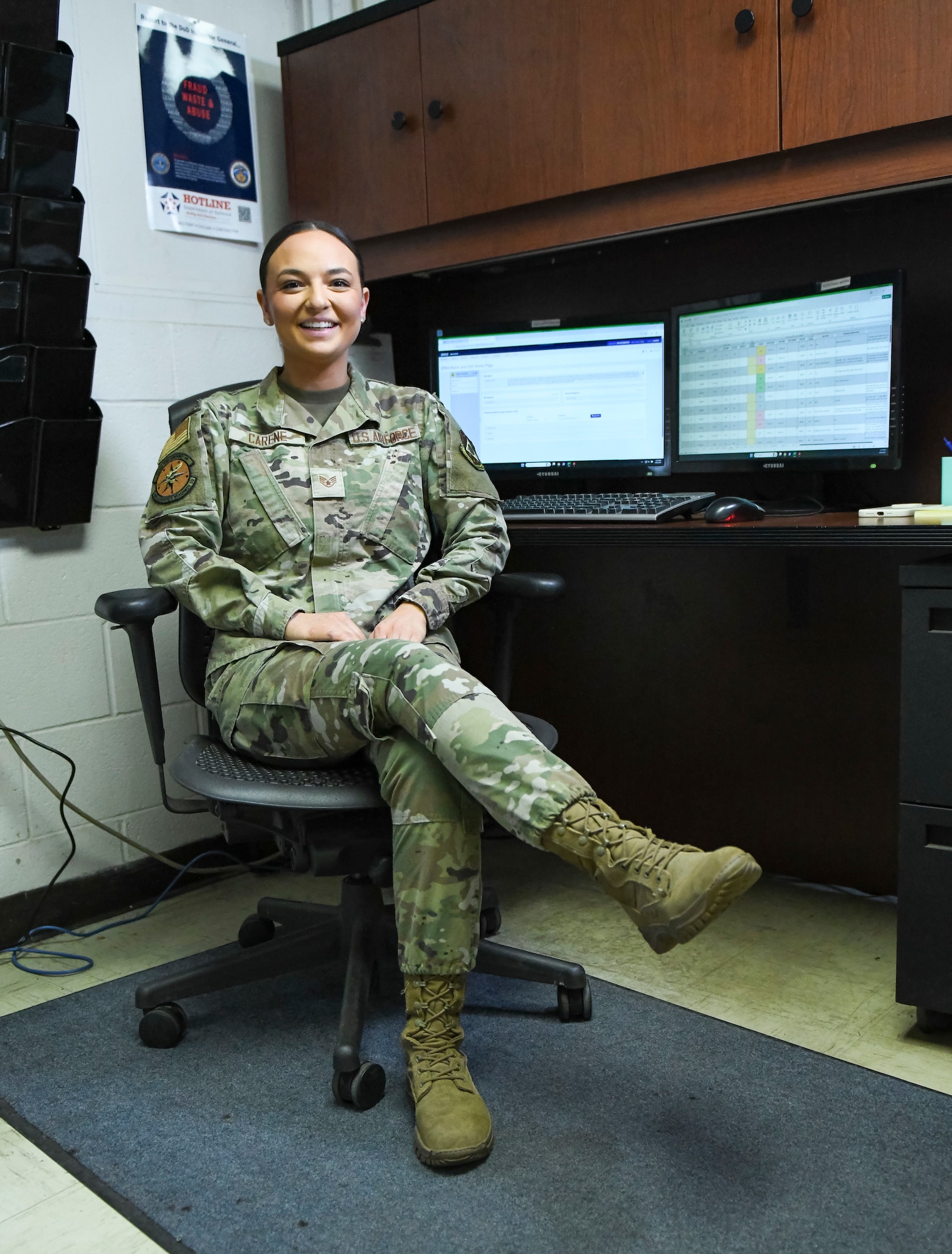 woman sits at desk