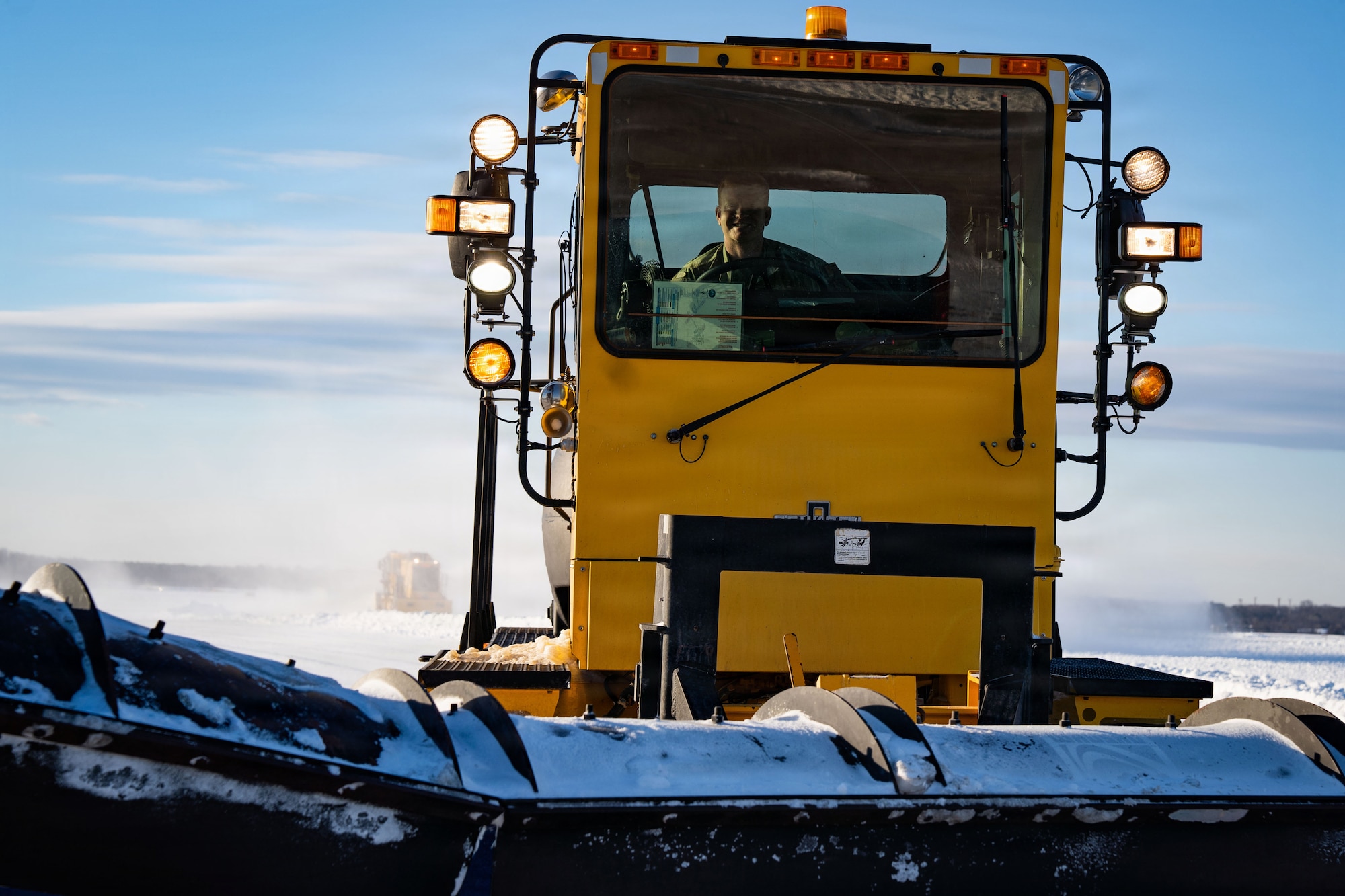 U.S. Air Force Tech. Sgt. Johnathan Russel, 628th Civil Engineering Squadron civil engineer, Joint Base Charleston, S.C., operates heavy snow removal equipment at Joint Base Andrews, Md., Jan. 29, 2026. Air Mobility Command mobilized mission-ready Airmen and specialized equipment in support of winter weather preparedness efforts to ensure “America’s Airfield” remained operational amid historic severe weather impacts. (U.S. Air Force photo by 1st Lt. Alexis Kula)