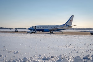 A U.S Air Force C-40 aircraft assigned to the 89th Airlift Wing sits on the airfield at Joint Base Andrews, Md., Jan. 29, 2026, after severe winter storm ‘Fern’ impacted the region. Air Mobility Command mobilized mission-ready Airmen and specialized equipment in support of winter weather preparedness efforts to ensure “America’s Airfield” remained operational amid historic severe weather impacts. (U.S. Air Force photo by 1st Lt. Alexis Kula)