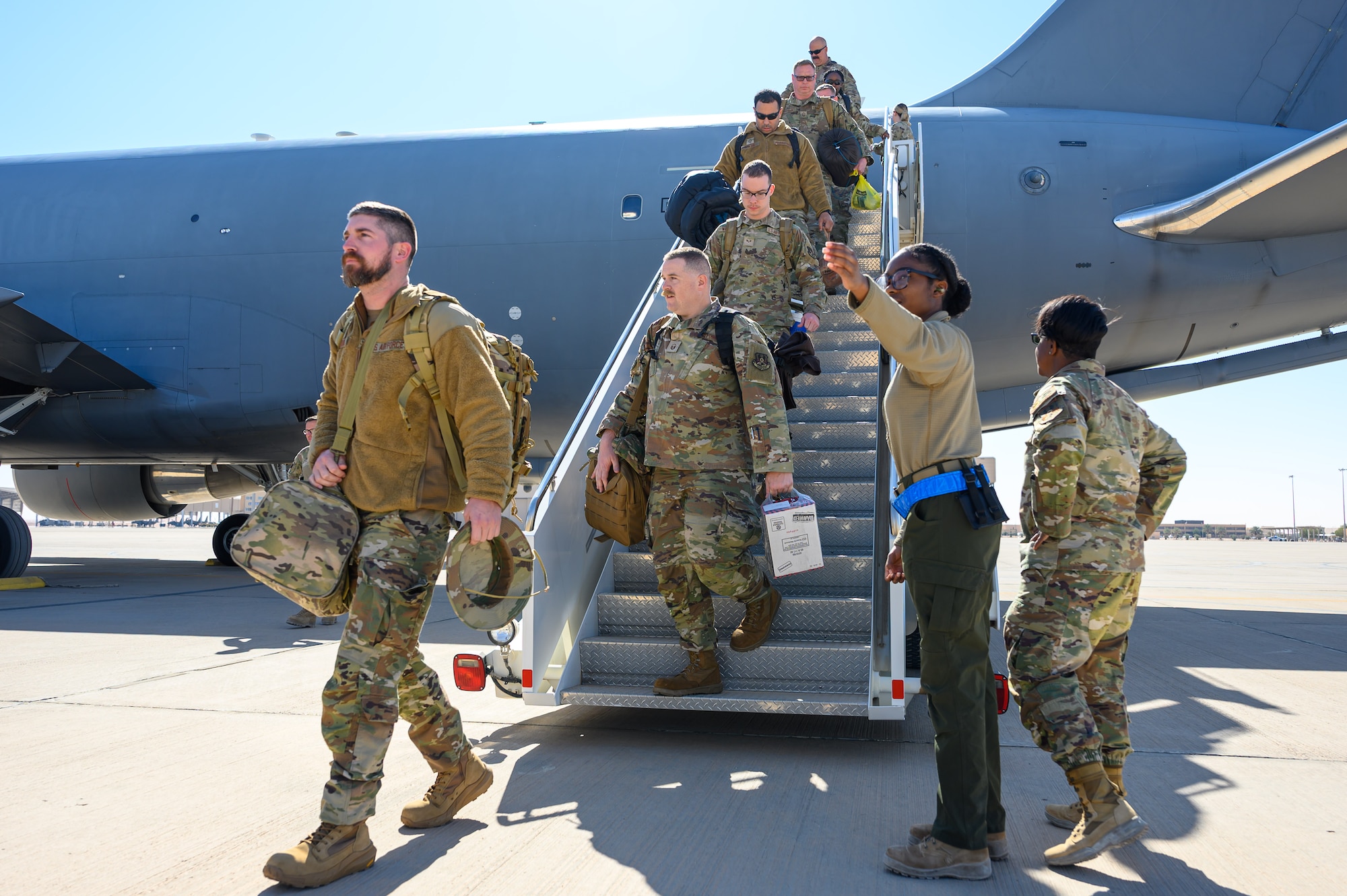 U.S. Airmen debark a KC-46A Pegasus aircraft after landing in the U.S. Central Command area of responsibility.