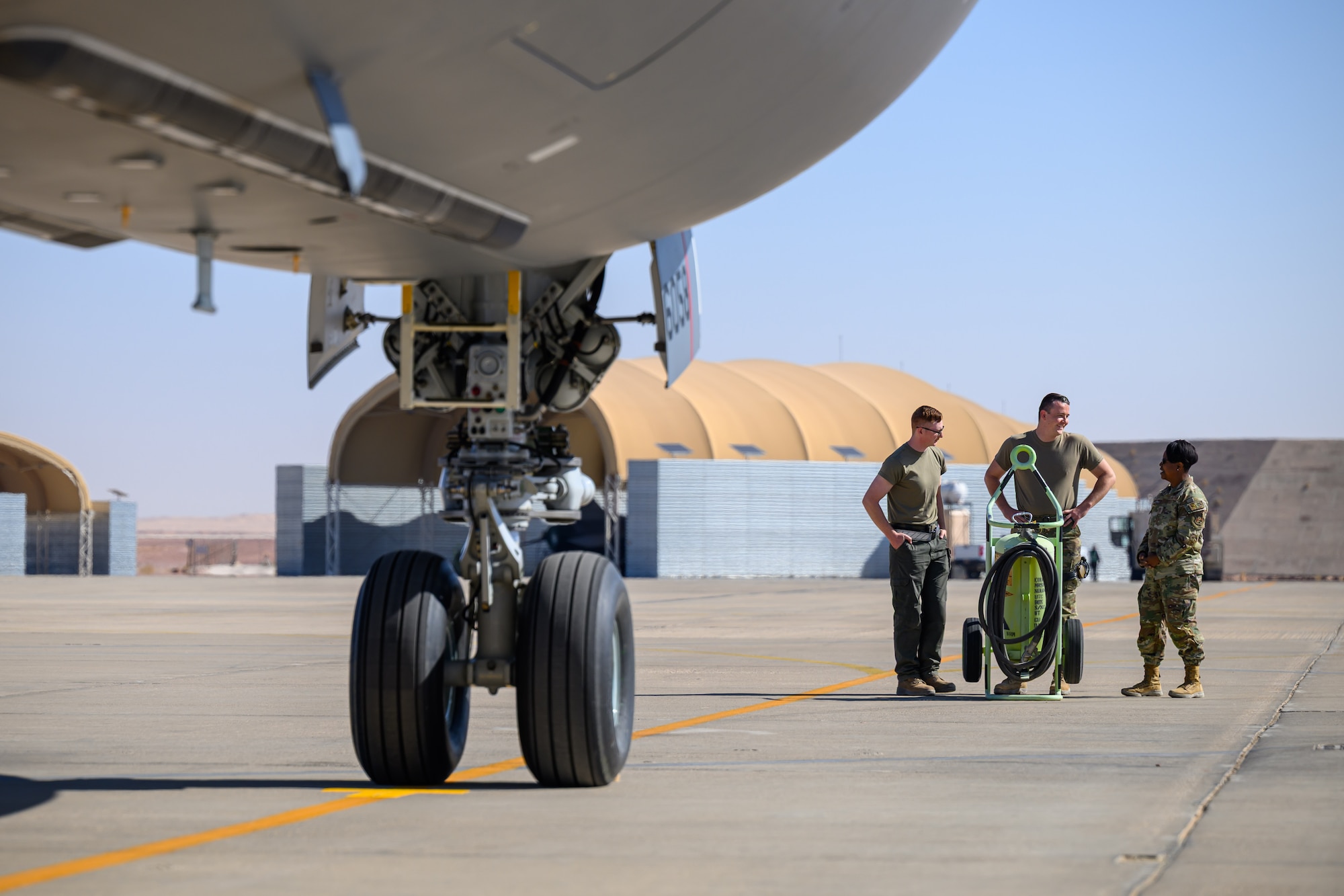 U.S. Air Force Chief Master Sgt. Chastity Hert, 378th Air Expeditionary Wing command chief, meets with ground crew assigned to the 378th Expeditionary Logistics Readiness Squadron after a KC-46A Pegasus aircraft arrived in the U.S. Central Command area of responsibility.
