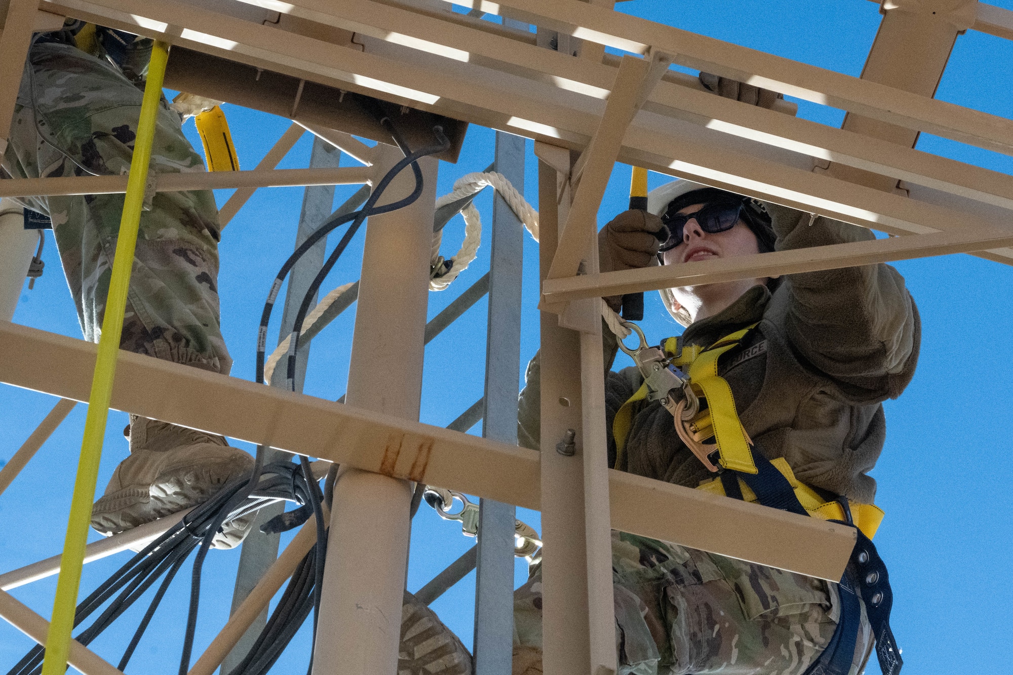 Staff Sgt. Jessica Ayala, Air Forces Central Deployed Regional Maintenance Center production control noncommissioned officer in charge, adjusts antennae heights on a glide slope in the U.S. Central Command area of responsibility Feb. 5, 2026. The antenna height adjustments fine-tuned glide slope angles to meet flight inspection and certification requirements. (U.S. Air Force photo by Senior Airman Kari Degraffenreed)
