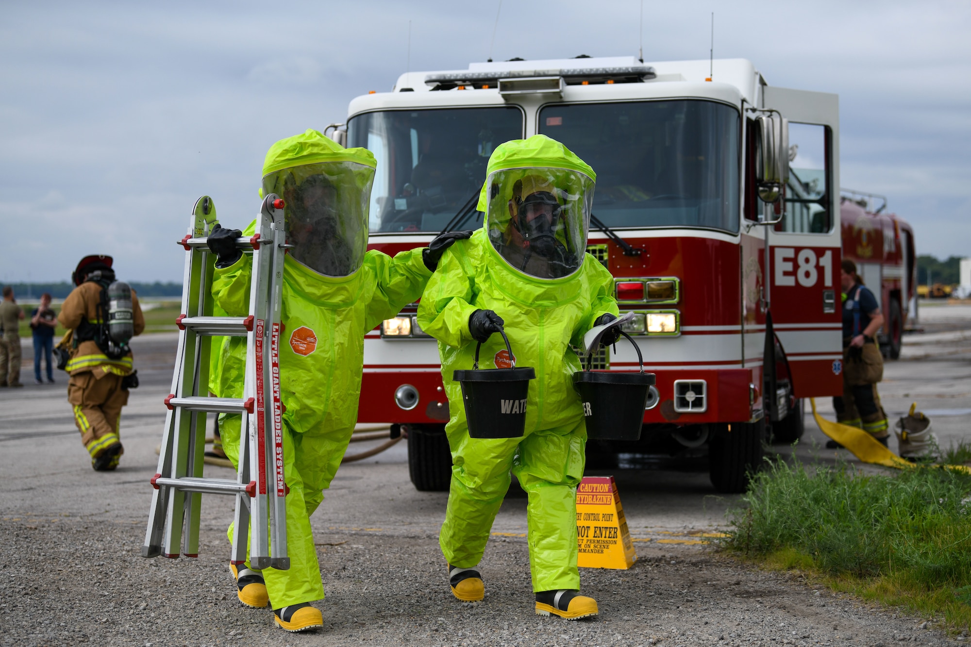 hazmat people carry equipment
