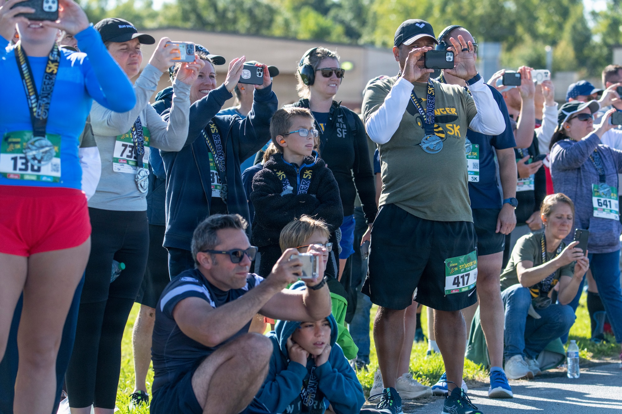 group of people take photos