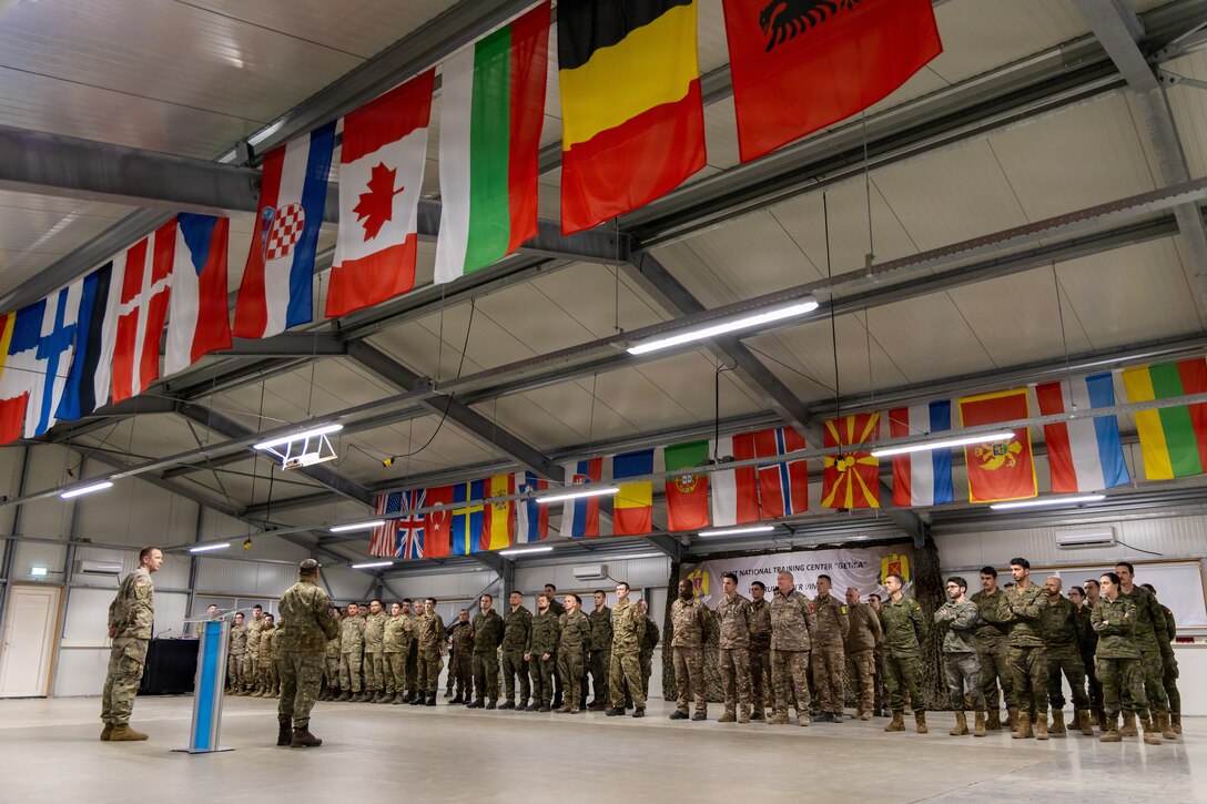 U.S. Army Soldiers stand in formation alongside six NATO partners for a recognition ceremony following the command post exercise for Dynamic Front 26, Feb. 05, 2026, in Cincu, Romania.