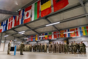 U.S. Army Soldiers stand in formation alongside six NATO partners for a recognition ceremony following the command post exercise for Dynamic Front 26, Feb. 05, 2026, in Cincu, Romania.