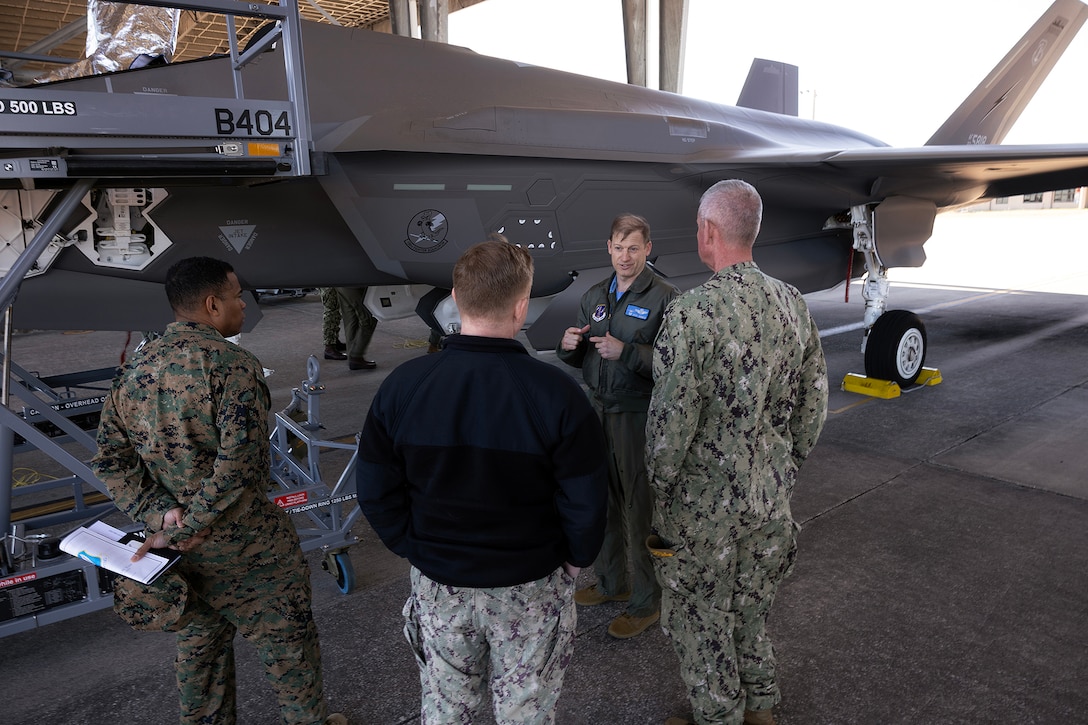U.S. Air Force Col. David Siemion, deputy commander of the 125th Fighter Wing, explains the capabilities of an F-35A Lightning II to Marine Corps Col. David Merles of Marine Corps Support Facility Blount Island, Navy Capt. Bill Dull of Naval Submarine Base Kings Bay, and Navy Capt. Craig Malloy of Navy Medicine Readiness and Training Command Jacksonville during a mission briefing and tour Feb. 6, 2026, at Jacksonville Air National Guard Base, Florida. The visit brought Navy and Marine Corps commanders together to strengthen joint readiness and regional partnerships. Siemion, a command pilot with combat experience in the F-15C, highlighted the aircraft’s controls and advances from prior generations. (Official Marine Corps photo by Dustin Senger)