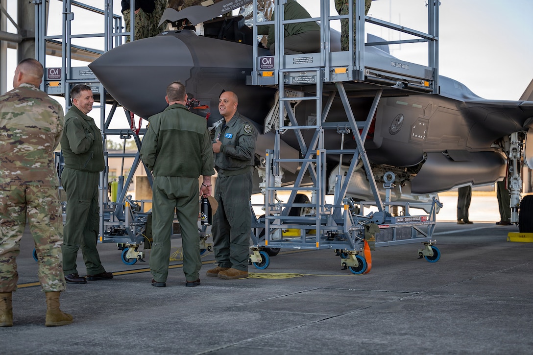U.S. Air Force Col. Mansour Elhihi, right, commander of the Florida Air National Guard’s 125th Fighter Wing, and U.S. Navy Capt. Ryan Dexter, left, commanding officer, NAS Jacksonville, engage in conversation with local military leaders during a tour at Jacksonville Air National Guard Base, Florida, Feb. 6, 2026. Inviting Jacksonville’s military leaders from Blount Island Command, Naval Air Station Jacksonville, Naval Submarine Base Kings Bay, Naval Station Mayport, and Navy Medical Readiness and Training Command to the Florida Air National Guard’s 125th Fighter Wing for a briefing on its missions and F-35A Lightning II aircraft fosters inter-service partnerships and strengthens relationships with the local military community. (U.S. Air National Guard photo by Tech. Sgt. Marissa Welker)
