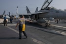 U.S. Navy Aviation Boatswain’s Mate (Handling) 3rd Class Daisy Rodriguez taxis an F/A-18F Super Hornet, attached to Strike Fighter Squadron (VFA) 41, on the flight deck of Nimitz-class aircraft carrier USS Abraham Lincoln (CVN 72) in the Arabian Sea, Feb. 4, 2026. Abraham Lincoln is deployed to the U.S. 5th Fleet area of operations to support maritime security and stability in the U.S. Central Command area of responsibility. (U.S. Navy photo by Mass Communication Specialist Seaman Apprentice Cesar Zavala)