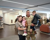 Illinois Army National Guard Sgt. Diego Santiago poses for a family photo with his 3-year-old son, Jacob Santiago, 1-year-old daughter, Juliette Santiago, and his partner and the children’s mother, Brendy Paz.