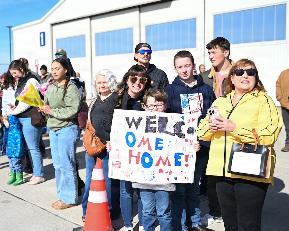Family and Families wait for the airplane carrying their Soldiers to arrive home.