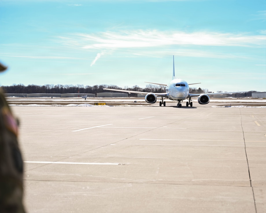 The airplane carrying about 50 Soldiers from the Illinois Army National Guard's Macomb-based 661st Engineer Construction Company lands in Springfield.