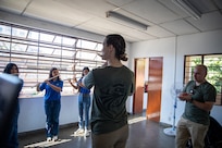 Sgt. Taylor Trudeau, a flutist with the 39th Army Band, leads a group of students during a master class at the National School of Music in El Salvador on Feb. 1, 2026. Looking on is Chief Warrant Officer 2 Franklin Montenegro, commander of the 39th.