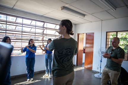 Sgt. Taylor Trudeau, a flutist with the 39th Army Band, leads a group of students during a master class at the National School of Music in El Salvador on Feb. 1, 2026. Looking on is Chief Warrant Officer 2 Franklin Montenegro, commander of the 39th.