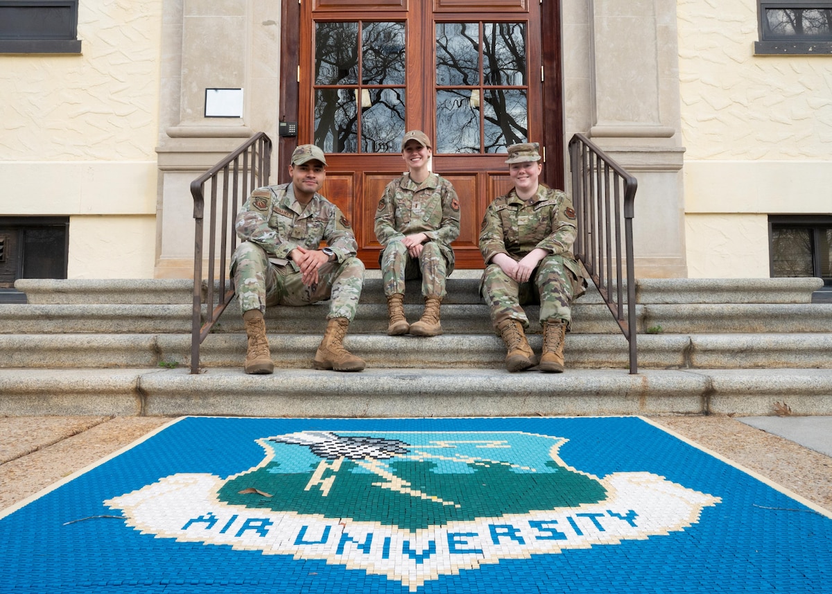 From left, U.S. Air Force Staff Sgt. Steven Hernandez, Air University commander’s support staff noncommissioned officer in charge, 2nd Lt. Shelby Pinner, AU CSS officer in charge, and Senior Airman Gabriella Mayfield, AU CSS technician, pose for a photo at Maxwell Air Force Base, Alabama, Feb. 3, 2026.