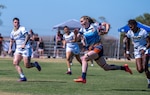 U.S. Coast Guard Women’s Rugby 7s players gain possession during the 6th annual Armed Forces Women’s Rugby Championship in Chula Vista, California, Sept., 2025. The tournament brings together athletes from the Army, Navy, Air Force, Marine Corps, and Coast Guard for elite-level competition. (U.S. Coast Guard photo by Petty Officer 3rd Class Annika Hirschler)