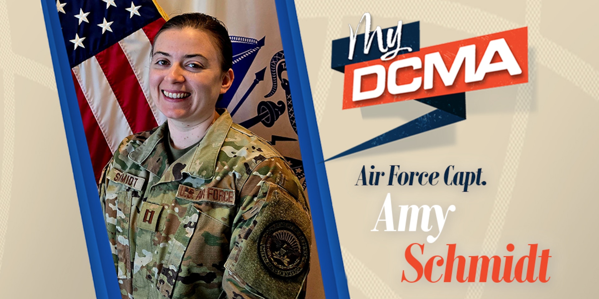 A smiling Amy Schmidt wears a military camouflage uniform while standing by the American flag