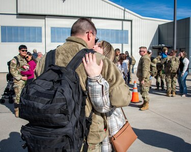 Illinois Army National Guard soldiers reunite with friends and family after arriving home from deployment.