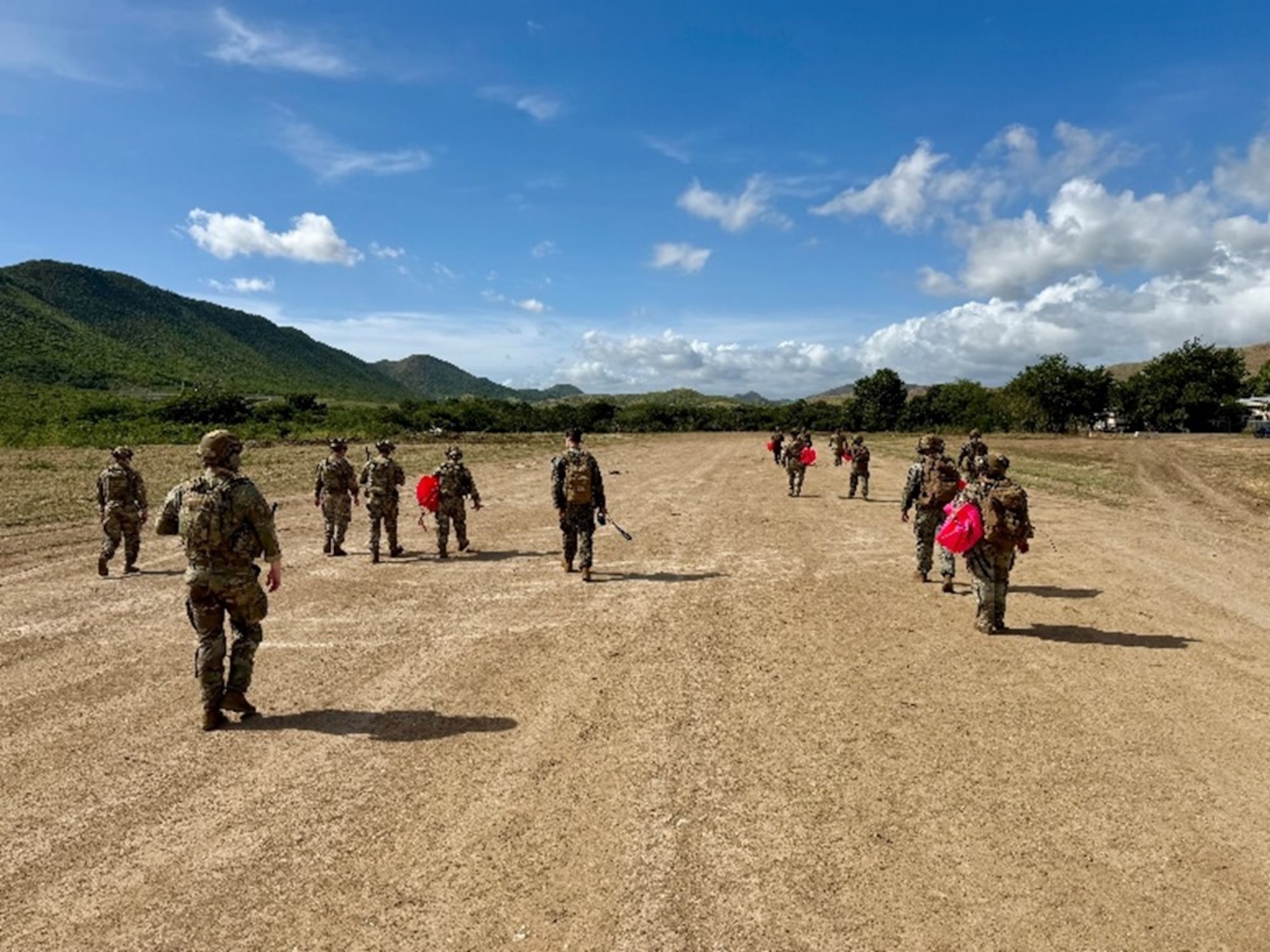 People walk in field.