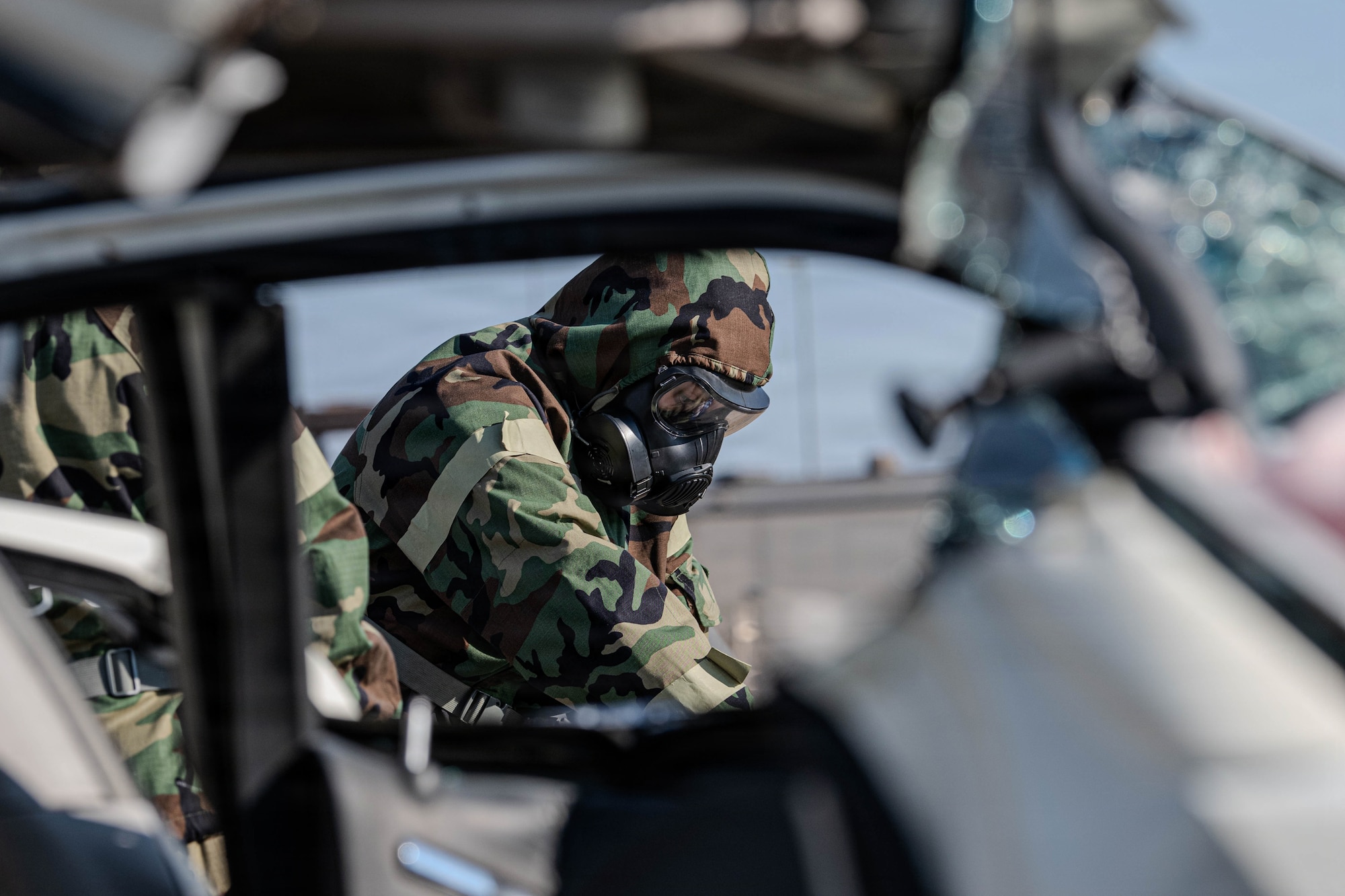Emergency Management Specialist follows sampling procedures for a simulated hazardous material