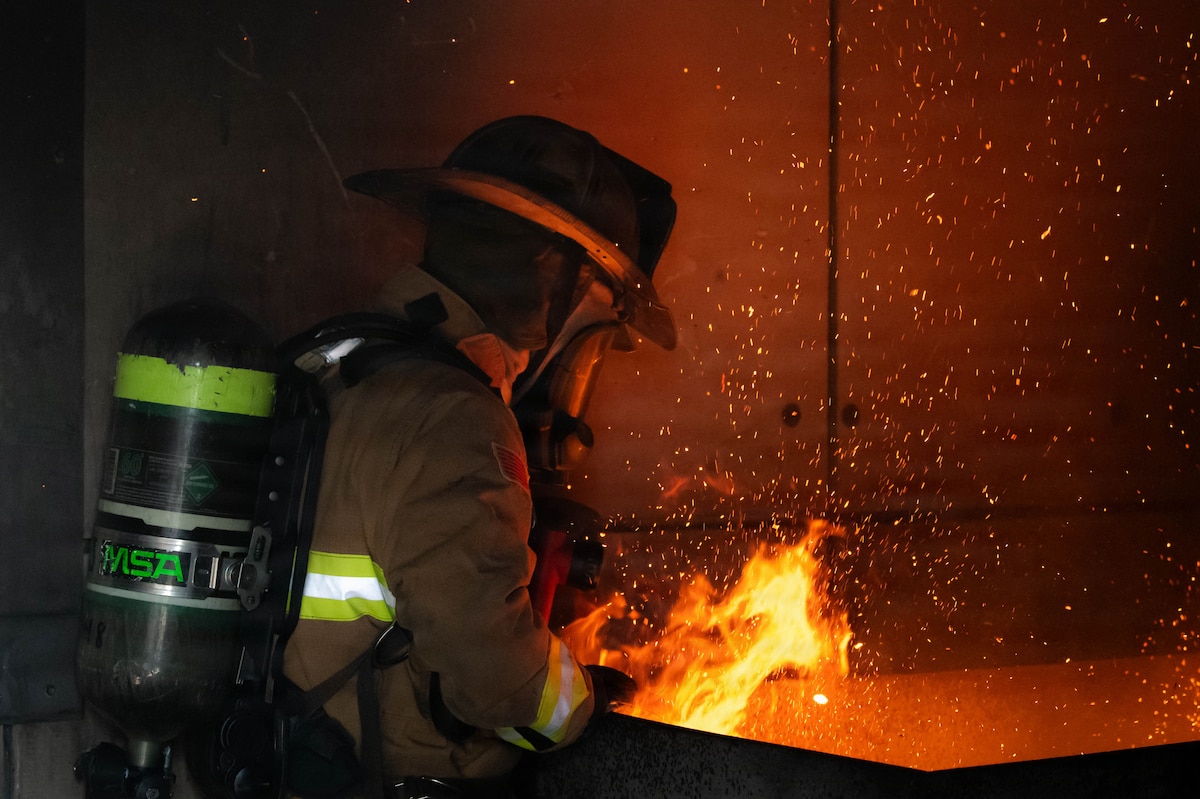 Firefighter participates in live-fire suppression training.