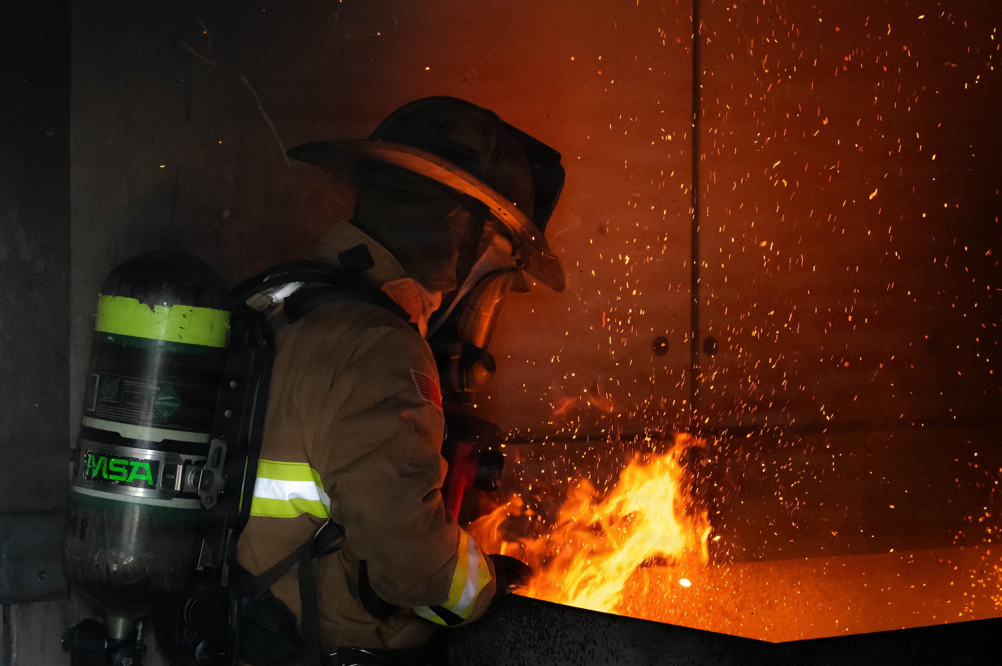 Firefighter participates in live-fire suppression training.