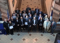NSWCPD Commanding Officer Capt. Joseph Darcy (far left) and Technical Director Nigel C. Thijs, SES (far right), stand with the 2025 Command Awards recipients during the annual Command Awards Ceremony at the Navy Yard in Philadelphia on January 13, 2026. The event honored individuals and teams for their outstanding dedication, innovation, and leadership in advancing the command’s mission and supporting the fleet.
 (U.S. Navy photo by Phillip Scaringi, CTR)