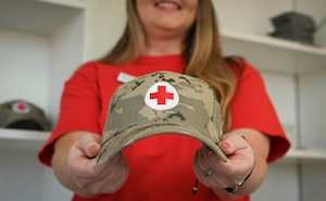 Ken Noltie, Red Cross volunteer lead, assists a customer at the Ehrling Bergquist Clinic pharmacy located at the 55th Medical Group facility, January 9, 2026. Noltie recruits volunteers primarily to assist in pharmacy operations to ease the workload demands for active-duty medical personnel. (U.S. Air Force photo by Daniel Martinez)