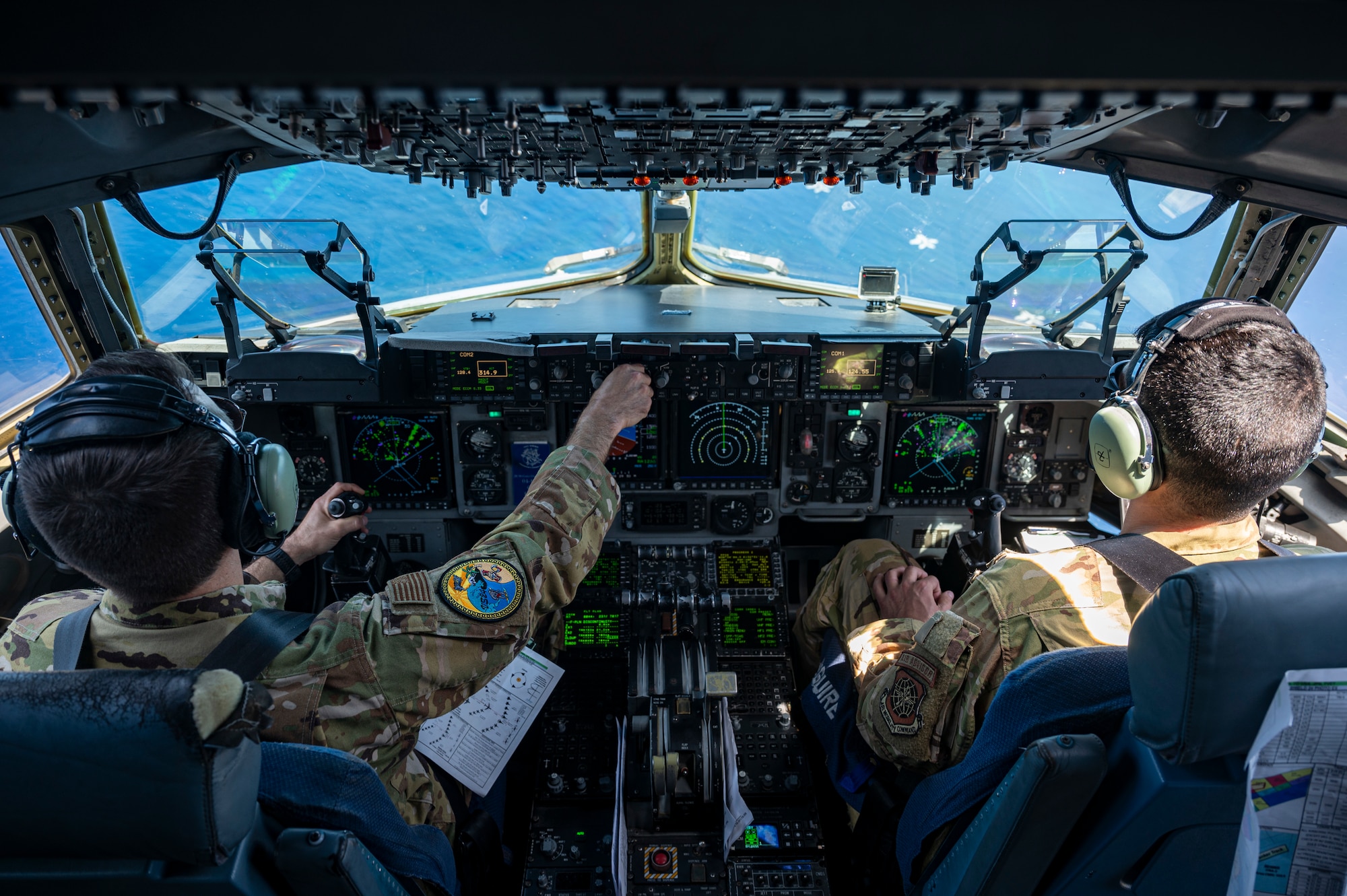 U.S. Air Force Lt. Col Matthew Eggert, 6th Airlift Squadron commander, left, and Maj. Andrew Quallio, 6AS C-17 Globemaster III pilot, right, pilot a U.S. Air Force C-17 Globemaster III alongside USAF, U.S. Navy, Japan Air Self-Defense Force aircraft in a formation over the Pacific Ocean in support of Valiant Shield 2024, June 7, 2024. Exercises such as Valiant Shield allow the Indo-Pacific Command Joint Forces the opportunity to integrate forces from all branches of service and with our allies to conduct precise, lethal, and overwhelming multi-axis, multi-domain effects that demonstrate the strength and versatility of the Joint Force and our commitment to a free and open Indo-Pacific. (U.S. Air Force photo by Senior Airman Keegan Putman)