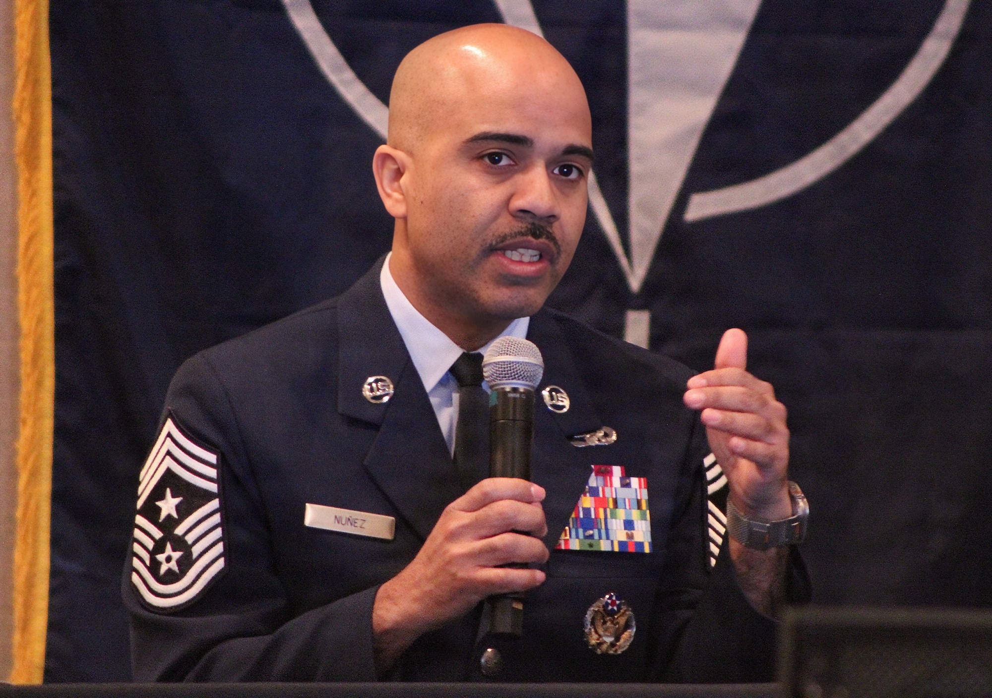 Chief Master Sgt. Israel Nuñez speaks to conference attendees.