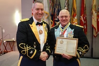 Col. Michael R. Kowalski presents Col. Seth Hibel with the Order of St. Maurice – Primicerius during the 33rd Infantry Brigade Combat Team military ball.
