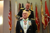 Col. Michael R. Kowalski presents Col. Seth Hibel with the Order of St. Maurice – Primicerius during the 33rd Infantry Brigade Combat Team military ball.