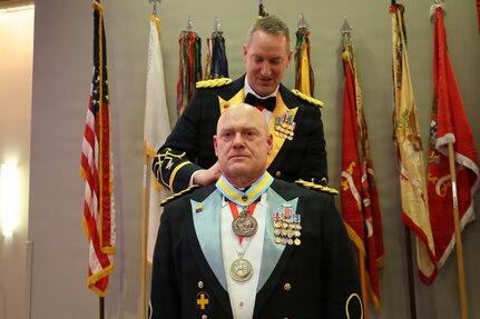 Col. Michael R. Kowalski presents Col. Seth Hibel with the Order of St. Maurice – Primicerius during the 33rd Infantry Brigade Combat Team military ball.